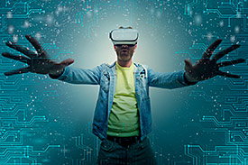man with outstretched arms wearing virtual reality glasses