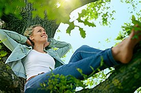 Happy woman relaxes in nature