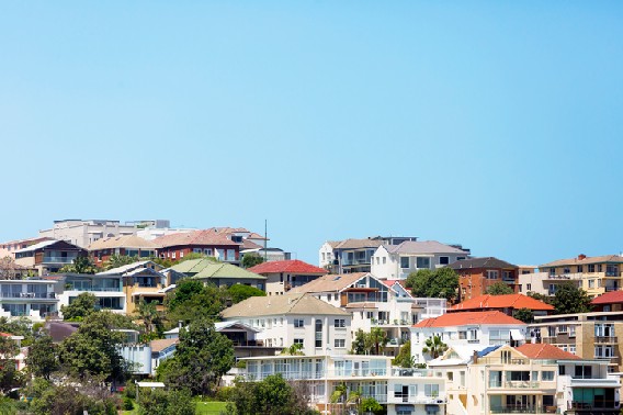 Landscape image of an Australian suburb with a lot of trees and houses in view