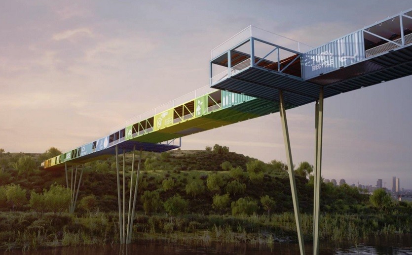 Colourful bridge crossing a river, built with old cargo containers