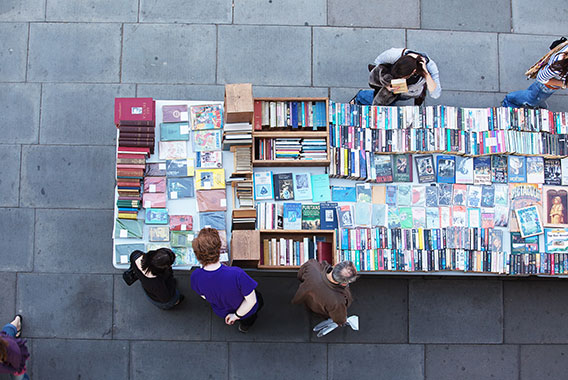 People browsing through a second hand book stall