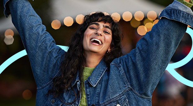 A woman celebrates maintaining good habits.